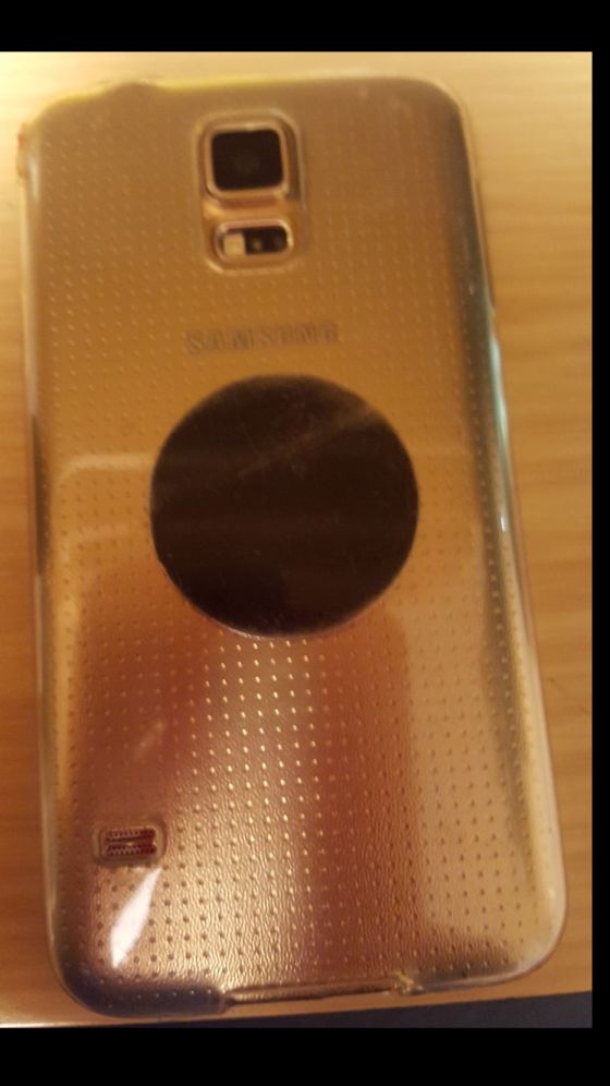 Magnetic disk on the back side of phone case.jpg