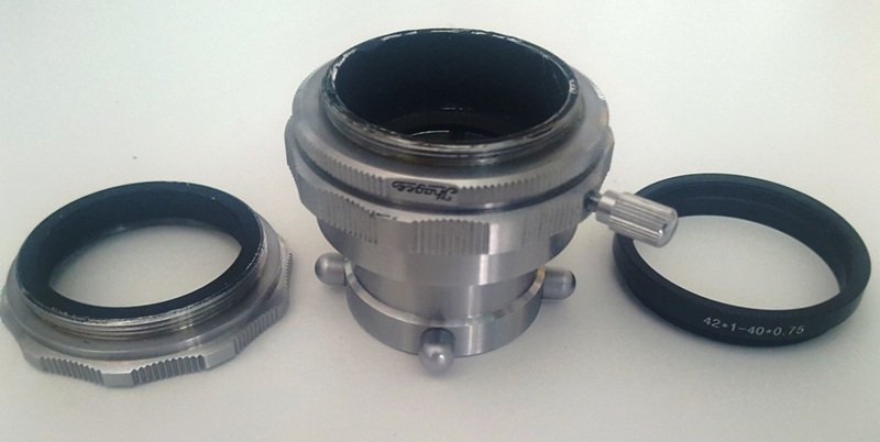 Adapter, left- original top ring, right- replacement light weight Chinese ring.jpg