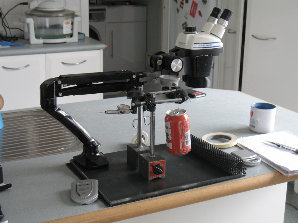 The setup to measure the spring rate of the monitor arm.  A lateral deflection force was applied by a calibrated can of beer, via a thread.  Static deflection was measured with a DTI.