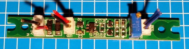 The fried Omax PCB. Incinerated chip at center.