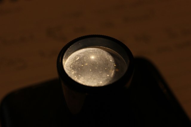 Old eyepiece on phone light.jpg